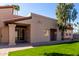 Backyard of home features a patio, lawn area, mature trees, and desert landscaping at 11210 N 109Th St, Scottsdale, AZ 85259