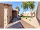 A well maintained backyard with desert landscaping, lawn, patio, and block wall at 11210 N 109Th St, Scottsdale, AZ 85259