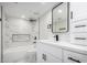 Beautifully updated bathroom with white vanity, black hardware, and marble-look tile shower at 11210 N 109Th St, Scottsdale, AZ 85259