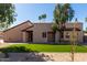 Charming single-story home featuring a well-manicured front yard with desert landscaping at 11210 N 109Th St, Scottsdale, AZ 85259