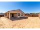 Wide backyard with covered patio, perfect for outdoor living and entertaining in the Arizona sunshine at 11620 W Marguerite Ave, Avondale, AZ 85323