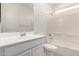 Bright bathroom featuring a white vanity, toilet and shower-tub combination at 11620 W Marguerite Ave, Avondale, AZ 85323