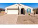 Charming single-story home with a two-car garage, neutral stucco exterior, and a well-maintained desert landscape at 11620 W Marguerite Ave, Avondale, AZ 85323