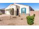 Attractive single-story home featuring a stucco exterior, desert landscaping, blue shutters, and a tile roof at 11620 W Marguerite Ave, Avondale, AZ 85323