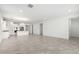 Open-concept living space with recessed lighting, tile flooring, and seamless flow into the kitchen at 11620 W Marguerite Ave, Avondale, AZ 85323