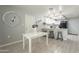 Dining area with wood-look floors, decorative accents, and open access to the kitchen at 12010 N 113Th Ave, Youngtown, AZ 85363