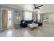 Bright living room with modern decor, wood-look floors, and lots of natural light at 12010 N 113Th Ave, Youngtown, AZ 85363