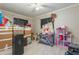 Bright storage room with light floors filled with stacked moving boxes; ideal for organization at 12010 N 113Th Ave, Youngtown, AZ 85363