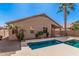 Inviting backyard pool with desert landscaping and a covered patio, perfect for relaxing and enjoying the outdoors at 12622 W Apodaca Dr, Litchfield Park, AZ 85340