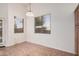 Bright dining area featuring large windows, tile flooring, and neutral paint at 12622 W Apodaca Dr, Litchfield Park, AZ 85340