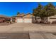 Charming single-story home featuring a well-maintained front yard and a convenient two-car garage at 12622 W Apodaca Dr, Litchfield Park, AZ 85340