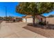 Charming single-story home featuring a well-maintained front yard and a convenient two-car garage at 12622 W Apodaca Dr, Litchfield Park, AZ 85340