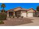 Inviting single-story home with desert landscaping, a palm tree, and a convenient two-car garage at 12622 W Apodaca Dr, Litchfield Park, AZ 85340