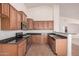 Beautiful kitchen featuring stainless steel appliances, stone counters, and wood cabinetry at 12622 W Apodaca Dr, Litchfield Park, AZ 85340