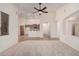 Bright and airy living room featuring an open layout that flows seamlessly into the kitchen space at 12622 W Apodaca Dr, Litchfield Park, AZ 85340