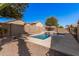 In-ground pool in a private backyard, surrounded by block walls and desert landscaping at 12622 W Apodaca Dr, Litchfield Park, AZ 85340