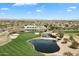 Aerial view of a community golf course featuring water features and lush greenery at 16769 W Brookhaven Ct, Surprise, AZ 85387