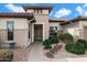 Inviting front entrance featuring a tiled walkway and desert landscaping with decorative rocks at 16769 W Brookhaven Ct, Surprise, AZ 85387