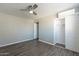 Bedroom featuring wood floors, AC unit and closet at 1715 E El Parque Dr, Tempe, AZ 85282