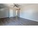 This bedroom features wood look flooring and a rustic barn door at 1715 E El Parque Dr, Tempe, AZ 85282