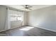 Bright bedroom with hardwood floors, a window, a ceiling fan, and neutral paint at 1715 E El Parque Dr, Tempe, AZ 85282