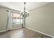 This dining room offers plank flooring and a view of the backyard at 1715 E El Parque Dr, Tempe, AZ 85282