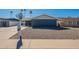 Charming single-story home featuring a well-kept gravel front yard and a clear blue sky at 1715 E El Parque Dr, Tempe, AZ 85282