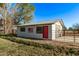 Barn with an American flag, offering a glimpse into countryside living and spacious outdoor facilities at 17335 W Cheryl Dr, Waddell, AZ 85355