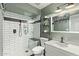 Bathroom featuring a walk-in shower, vanity sink and fixtures, and tile flooring at 17335 W Cheryl Dr, Waddell, AZ 85355