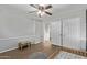 Bedroom with a modern design, decorative wall and wood-look floors at 17335 W Cheryl Dr, Waddell, AZ 85355