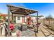 Outdoor patio area with a fire pit and seating, perfect for cozy gatherings and enjoying the serene surroundings at 17335 W Cheryl Dr, Waddell, AZ 85355