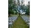 Outdoor venue set up with rows of white chairs on the grass, perfect for special events at 17335 W Cheryl Dr, Waddell, AZ 85355