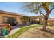 Serene backyard with lush landscaping, a covered patio, and scenic desert views at 17366 E Via Del Oro St, Fountain Hills, AZ 85268