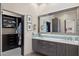 Bathroom with double vanity, a large mirror, and a walk-in closet on the left at 17366 E Via Del Oro St, Fountain Hills, AZ 85268