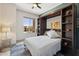 Bedroom with a murphy bed, bookshelves, a ceiling fan, and a window with a view at 17366 E Via Del Oro St, Fountain Hills, AZ 85268