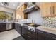 Modern kitchen featuring stainless steel appliances and custom backsplash at 17366 E Via Del Oro St, Fountain Hills, AZ 85268