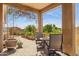 Charming covered patio with outdoor seating and lush garden views at 17366 E Via Del Oro St, Fountain Hills, AZ 85268