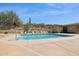 Community pool offers a refreshing escape with ample seating and picturesque desert views on a sunny day at 17366 E Via Del Oro St, Fountain Hills, AZ 85268