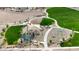 Aerial view of the community playground with benches and green space at 18334 W Desert Hollow Dr, Wittmann, AZ 85361