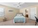 Bedroom with carpet and a bed with light blue quilt at 1893 S Sinova S Ave, Gilbert, AZ 85295