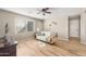 A sitting area compliments the bedroom with a ceiling fan and wood flooring at 1893 S Sinova S Ave, Gilbert, AZ 85295