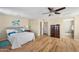 The main bedroom features wood flooring and a door to the ensuite bathroom at 1893 S Sinova S Ave, Gilbert, AZ 85295