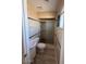 Bright bathroom with a shower, toilet, and sink with cabinet storage underneath at 1950 E Wier Ave, Phoenix, AZ 85040