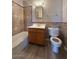 Bathroom view with a decorative tiled shower, modern vanity, and toilet at 1950 E Wier Ave, Phoenix, AZ 85040