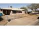 Cozy single-story home with a covered carport and minimal landscaping at 1950 E Wier Ave, Phoenix, AZ 85040