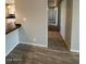 Hallway that features sleek flooring and leads to other rooms in the home at 1950 E Wier Ave, Phoenix, AZ 85040