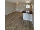 Open-concept living area with pendant lighting and dark countertop bar seating at 1950 E Wier Ave, Phoenix, AZ 85040