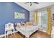 Cozy bedroom with a whimsical vanity, plush toys, and a white metal frame bed at 20837 N 23Rd Pl, Phoenix, AZ 85024