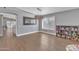 Bright dining room with wood floors, modern lighting, and adjacent living spaces at 20837 N 23Rd Pl, Phoenix, AZ 85024