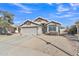 Charming home featuring a well-manicured lawn, two car garage and desert landscaping at 20837 N 23Rd Pl, Phoenix, AZ 85024